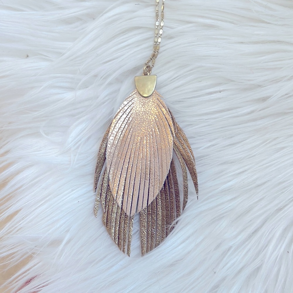 Necklace. Rose gold and bronze feather with a gold chain. Fashion jewelry